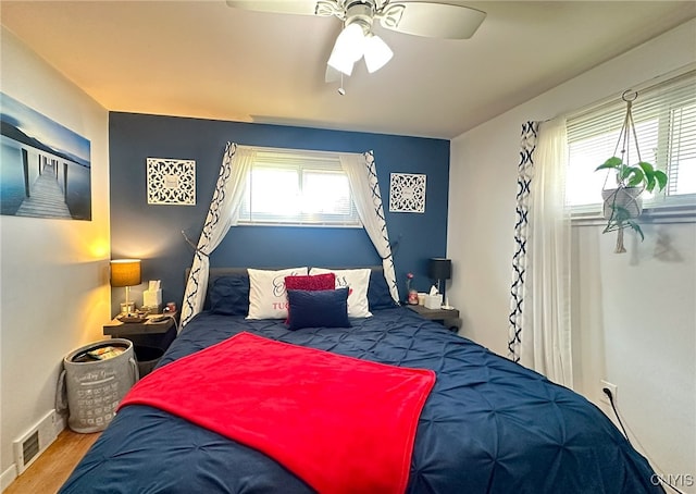 bedroom featuring wood-type flooring and ceiling fan