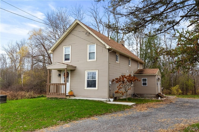 front facade with a front yard