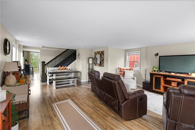 living room with light hardwood / wood-style floors