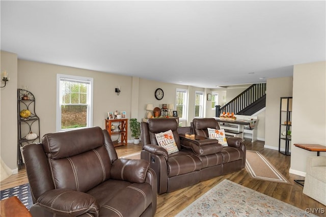 living room featuring a healthy amount of sunlight and hardwood / wood-style floors