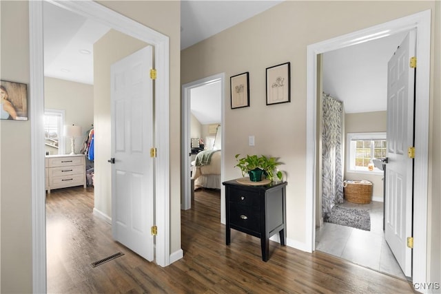 hall with dark hardwood / wood-style flooring