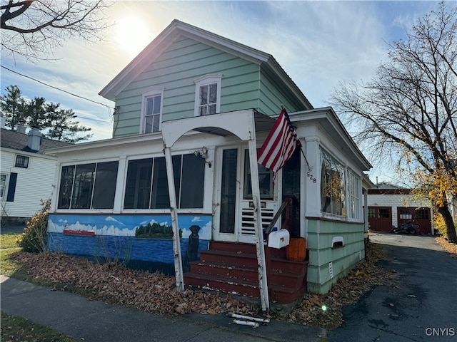 view of front of house with a sunroom