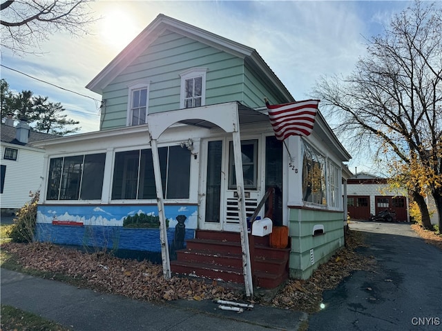 view of front of home with a sunroom