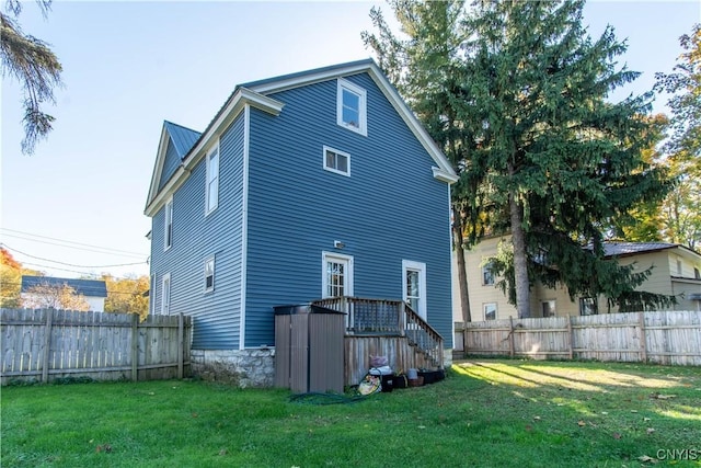 rear view of house with a lawn