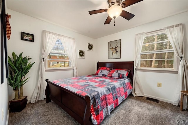 carpeted bedroom with ceiling fan