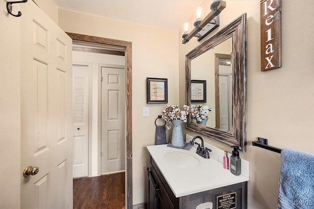 bathroom featuring hardwood / wood-style flooring and vanity