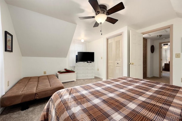 carpeted bedroom featuring a closet, ceiling fan, and lofted ceiling