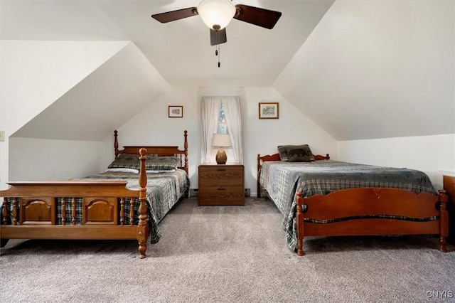 carpeted bedroom with vaulted ceiling and ceiling fan