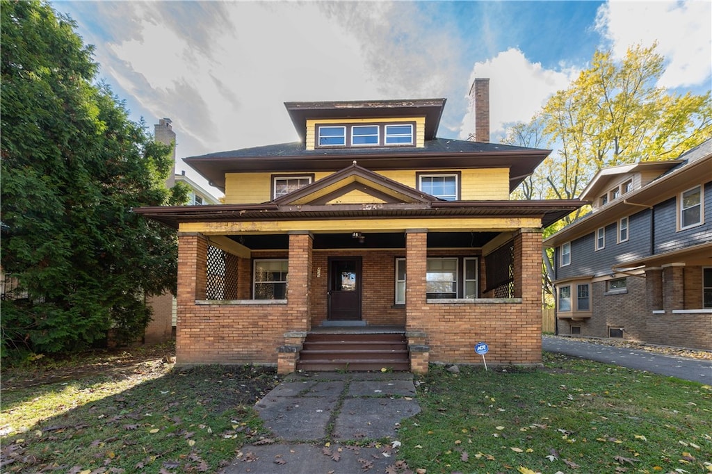 409 Arnett Blvd, Rochester, NY 14619 - view of front of home featuring a front yard and a porch