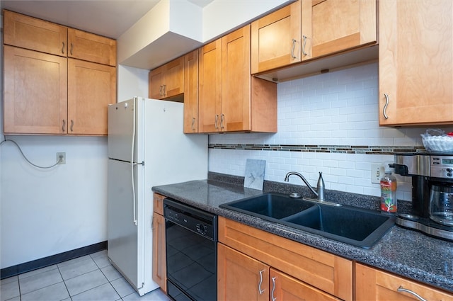 kitchen featuring dark stone counters, sink, backsplash, and black dishwasher