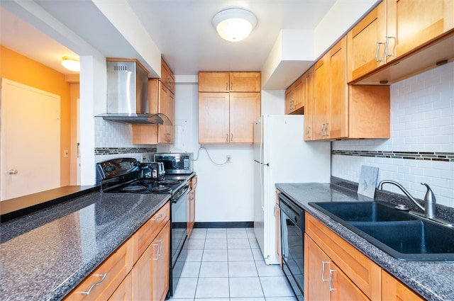 kitchen with sink, black appliances, tasteful backsplash, light tile patterned floors, and wall chimney range hood