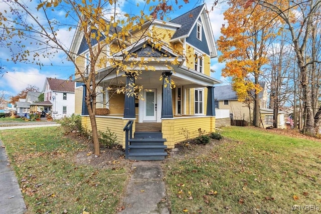 view of front of house featuring a porch and a front yard