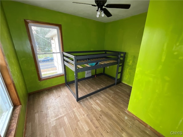 bedroom featuring ceiling fan and light hardwood / wood-style flooring