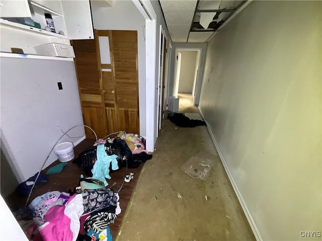 353 S James St, Wilna, NY 13619 - corridor with unfinished concrete flooring and baseboards