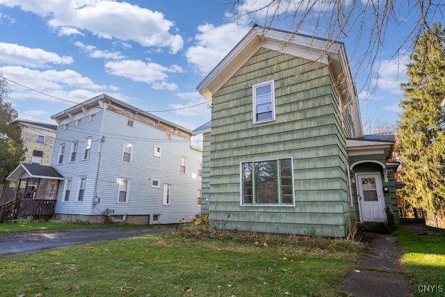 view of side of property with a yard