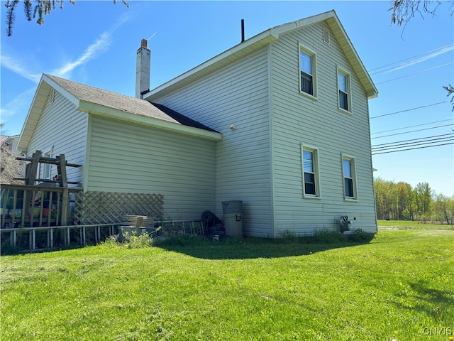 rear view of house with a lawn