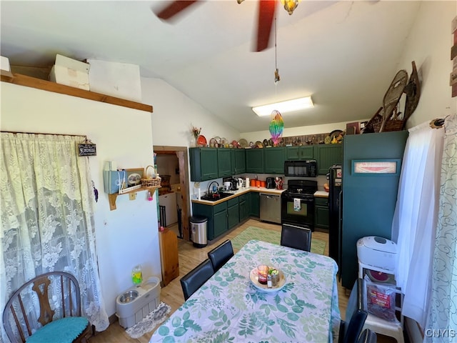 kitchen with light hardwood / wood-style floors, sink, black appliances, ceiling fan, and lofted ceiling