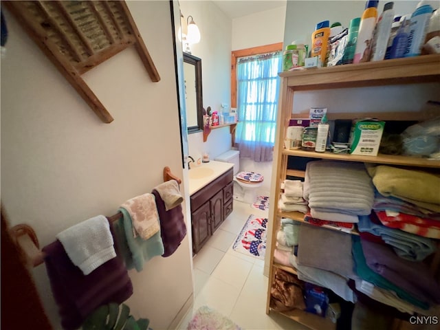 bathroom with tile patterned flooring and vanity