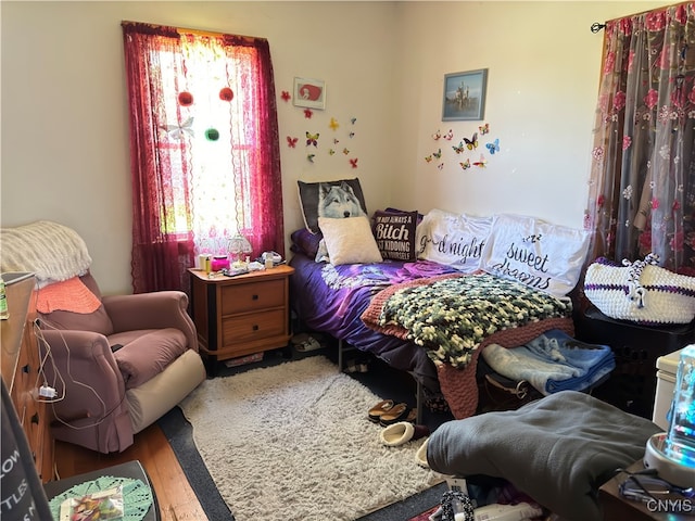 bedroom featuring wood-type flooring