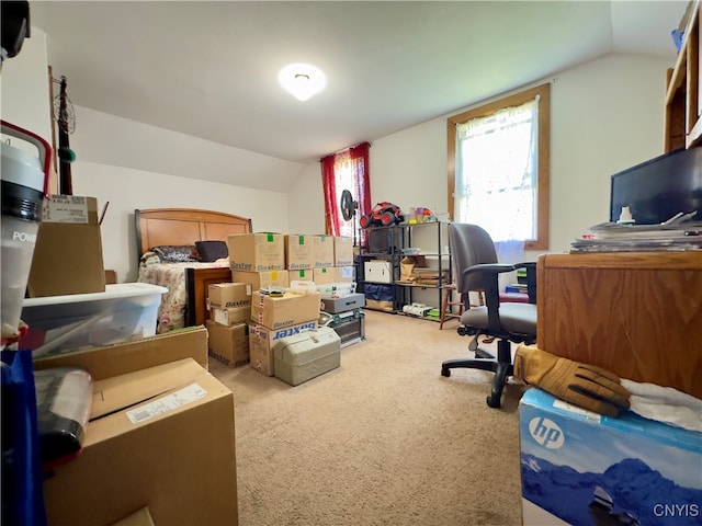 home office featuring carpet and vaulted ceiling