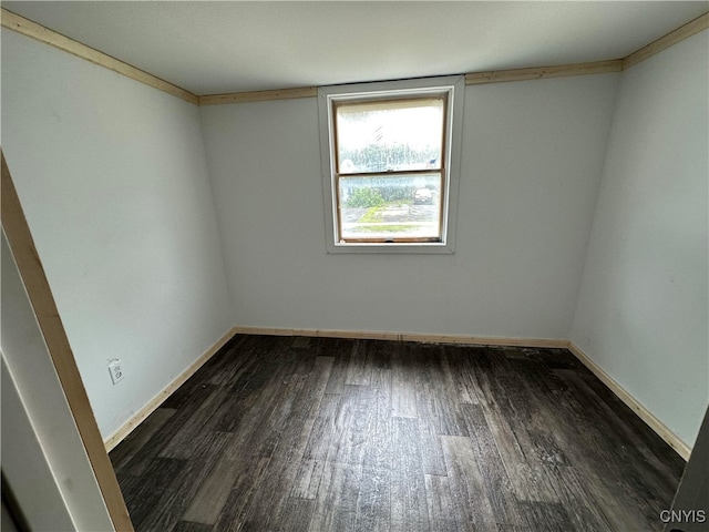 spare room featuring dark hardwood / wood-style flooring