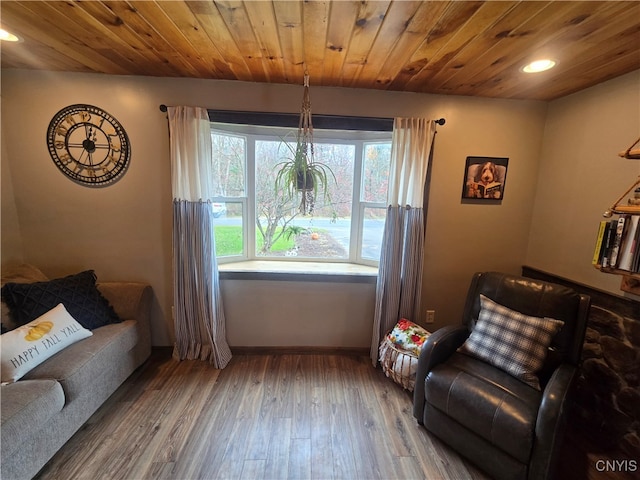 sitting room featuring hardwood / wood-style floors and wood ceiling