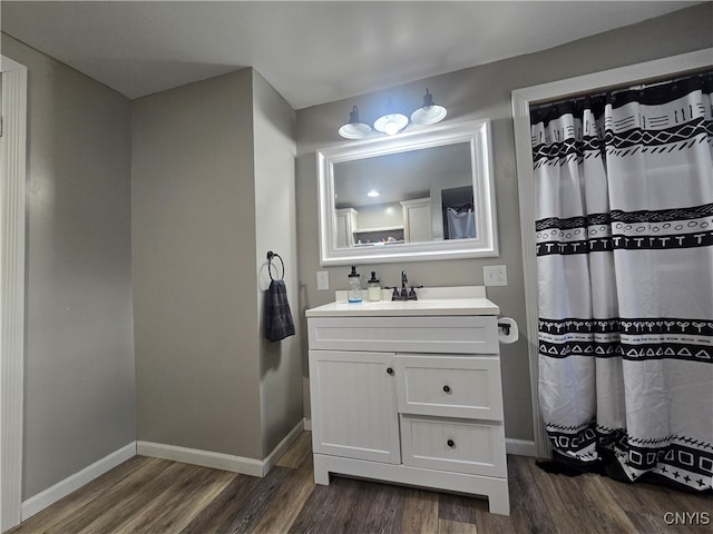 bathroom with wood-type flooring and vanity