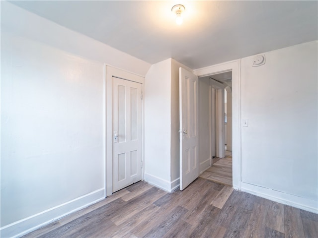 spare room with hardwood / wood-style flooring