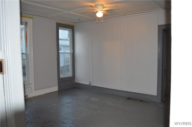 spare room with ceiling fan and dark hardwood / wood-style flooring