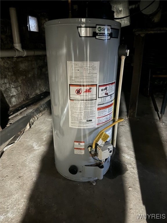 utility room featuring water heater