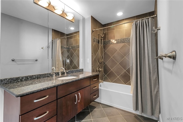 bathroom with tile patterned floors, vanity, and shower / bathtub combination with curtain