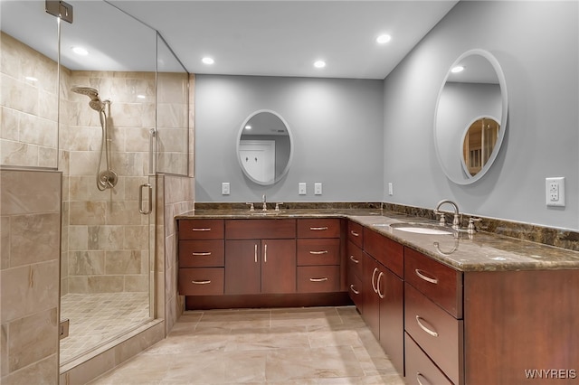 bathroom with an enclosed shower and vanity