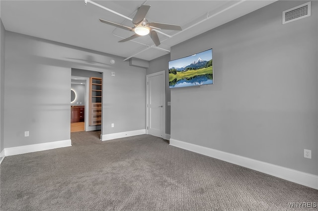 unfurnished bedroom with connected bathroom, a closet, ceiling fan, and carpet flooring