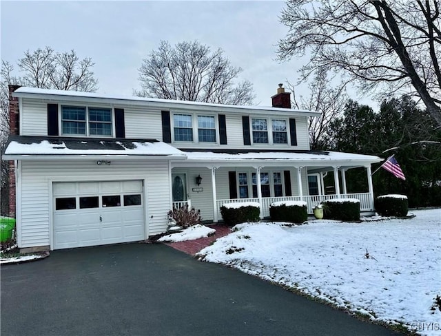 view of front of property featuring a porch and a garage