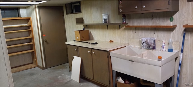 kitchen with tile counters and sink