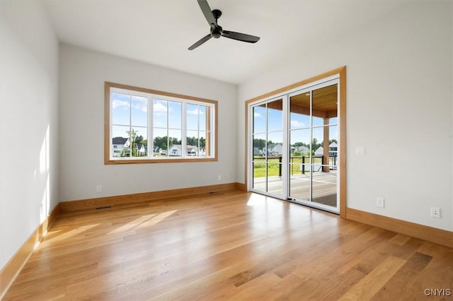 empty room featuring ceiling fan and light wood-type flooring