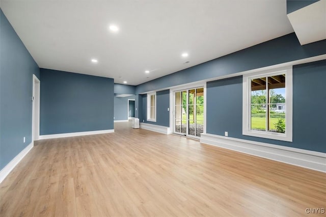 unfurnished living room with light hardwood / wood-style floors