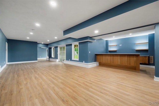 unfurnished living room with light hardwood / wood-style floors