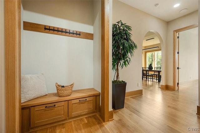 mudroom with light hardwood / wood-style floors