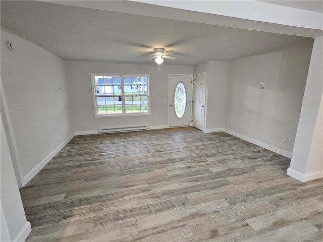 foyer featuring a baseboard heating unit, light hardwood / wood-style flooring, and ceiling fan