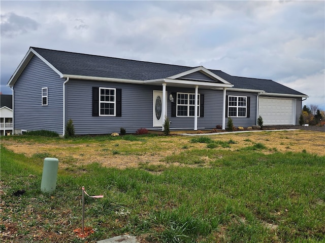 ranch-style house with a garage and a front yard