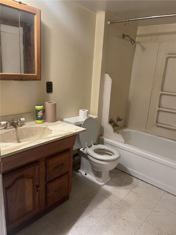 full bathroom with  shower combination, tile patterned floors, vanity, and toilet