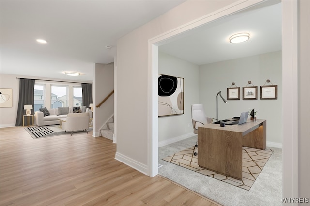 office space with light hardwood / wood-style floors