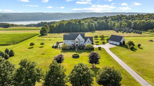 birds eye view of property with a rural view and a water view