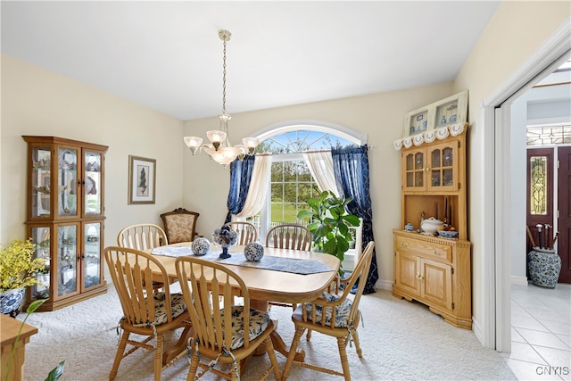 carpeted dining space featuring a chandelier and a healthy amount of sunlight