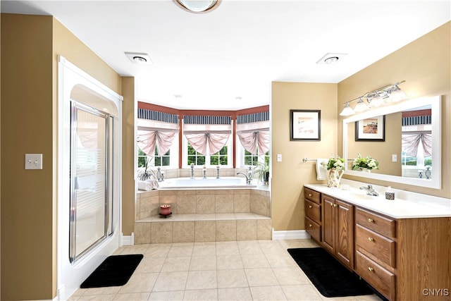 bathroom with tile patterned flooring, a wealth of natural light, vanity, and plus walk in shower