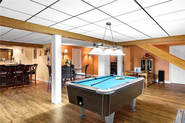 game room featuring pool table, hardwood / wood-style floors, bar, and a drop ceiling