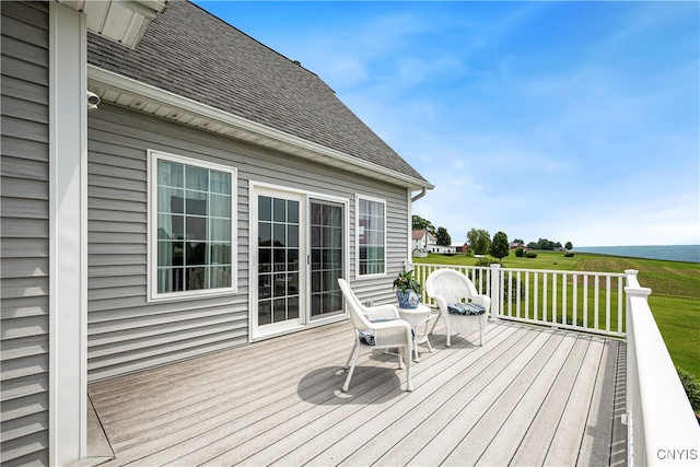 wooden deck with a lawn