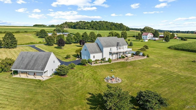 birds eye view of property featuring a rural view