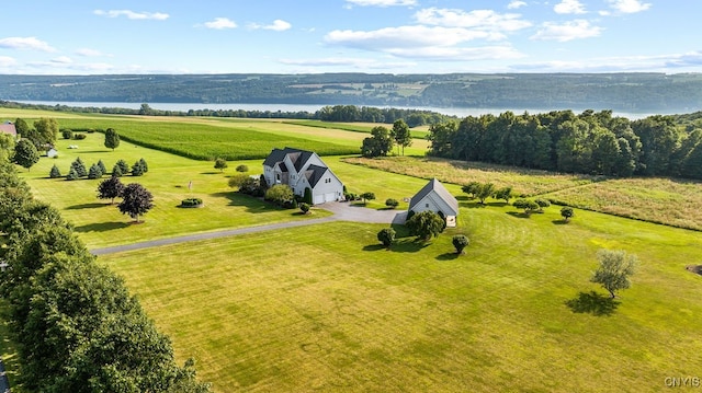 drone / aerial view featuring a water view and a rural view